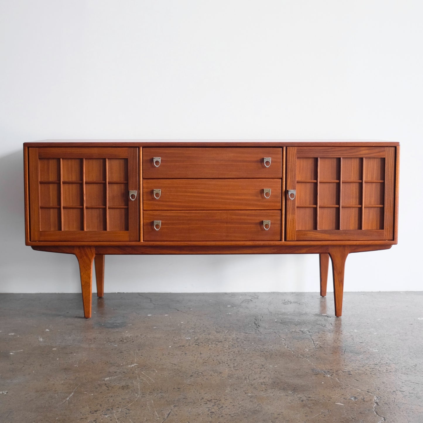A. Younger Teak Credenza