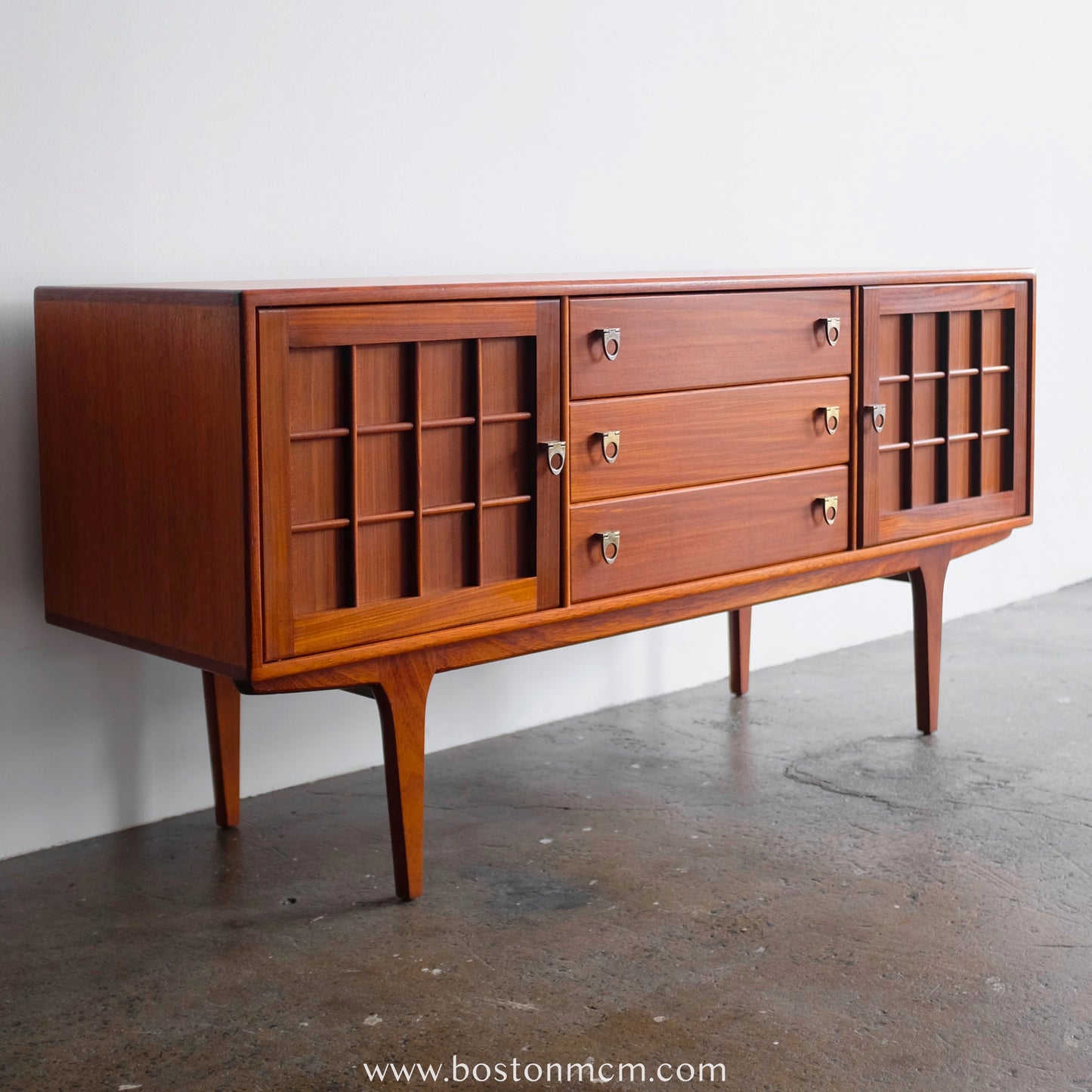 A. Younger Teak Credenza