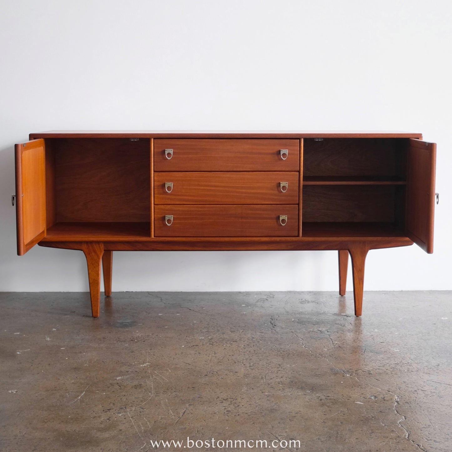 A. Younger Teak Credenza