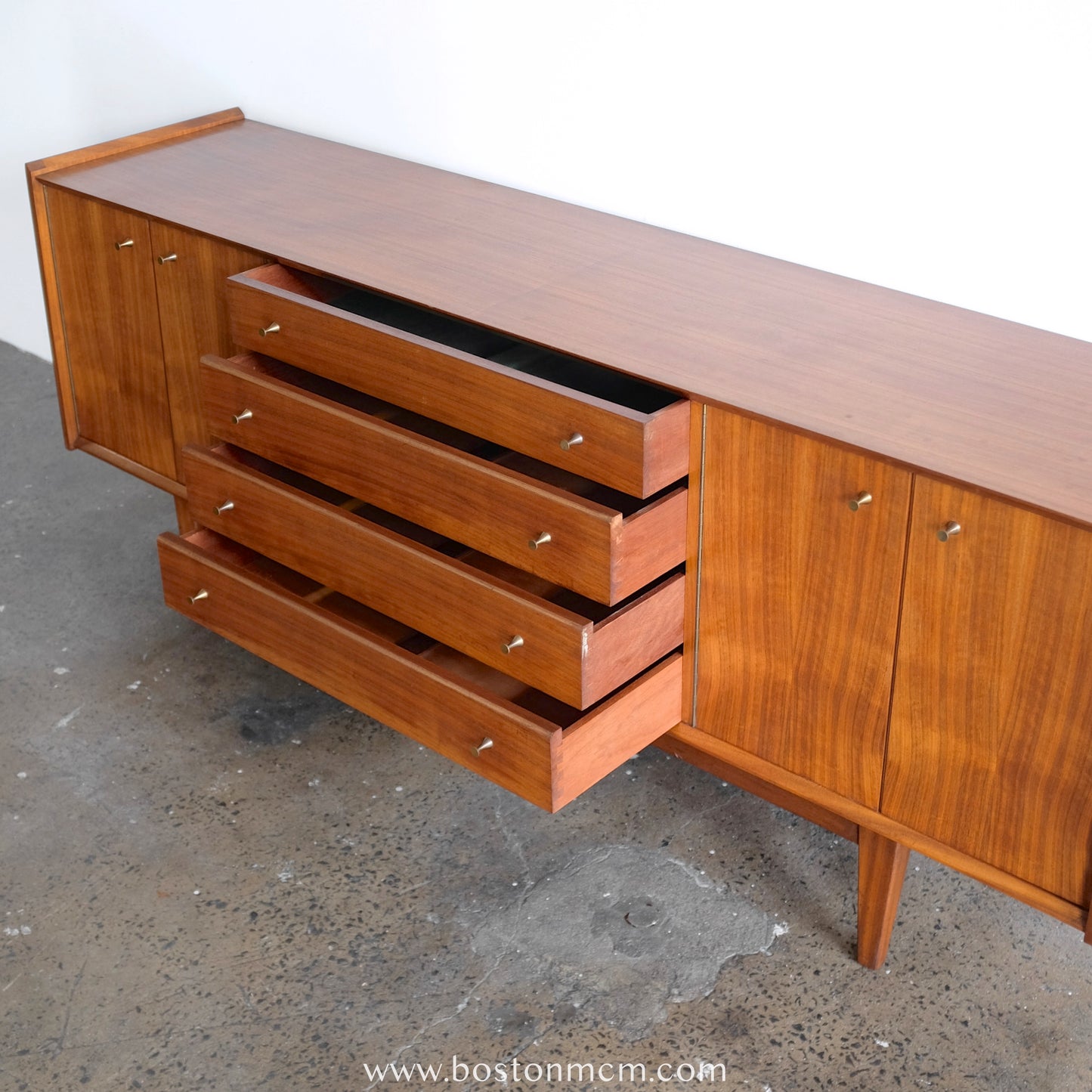 A. Younger Teak Credenza