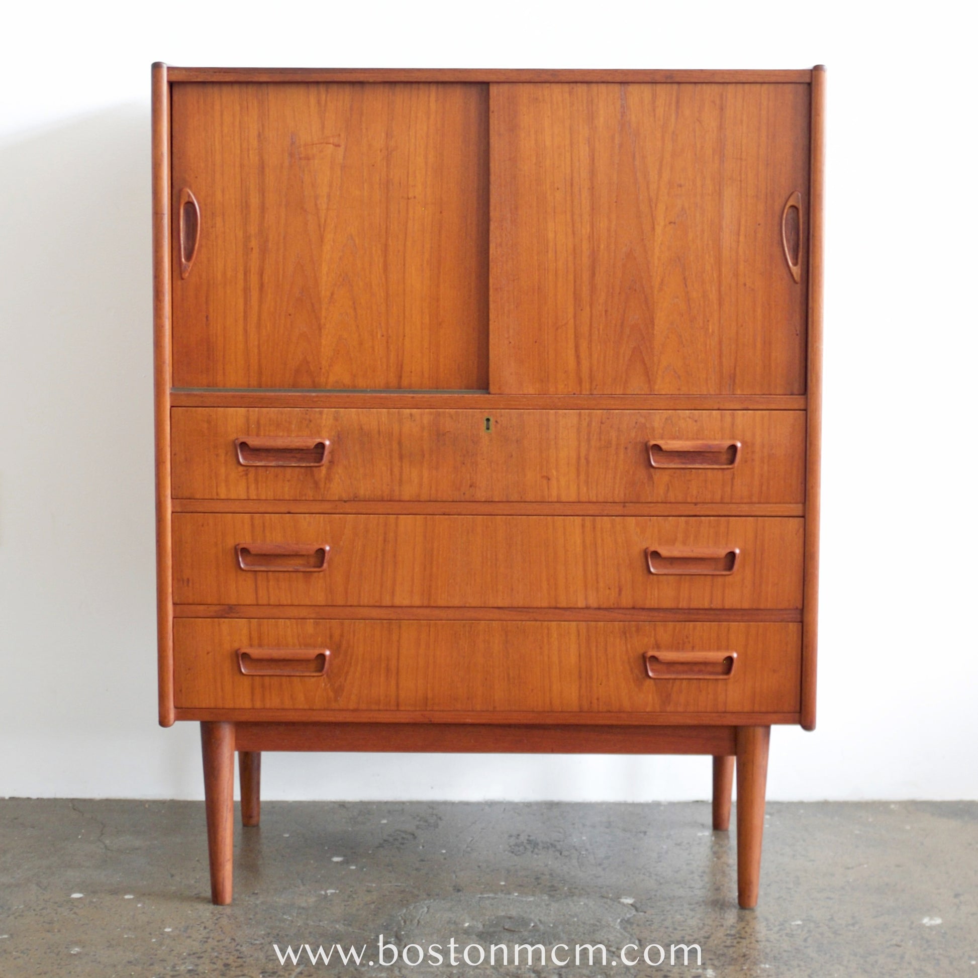 mid century modern teak dresser Vintage teak 9 drawer dresser with round handles TEAKFINDER