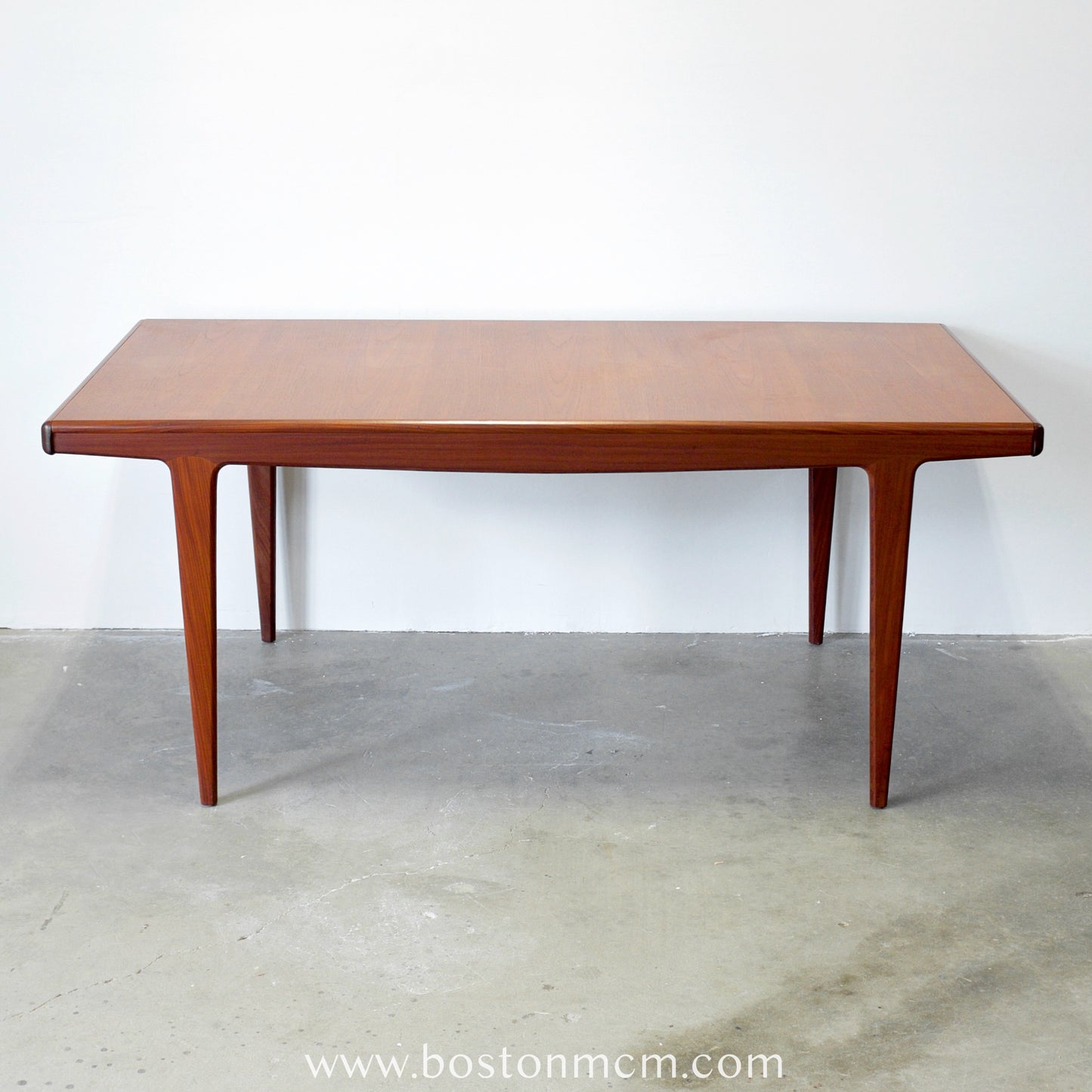 A. Younger Furniture Teak Dining Table with Hidden Leaves