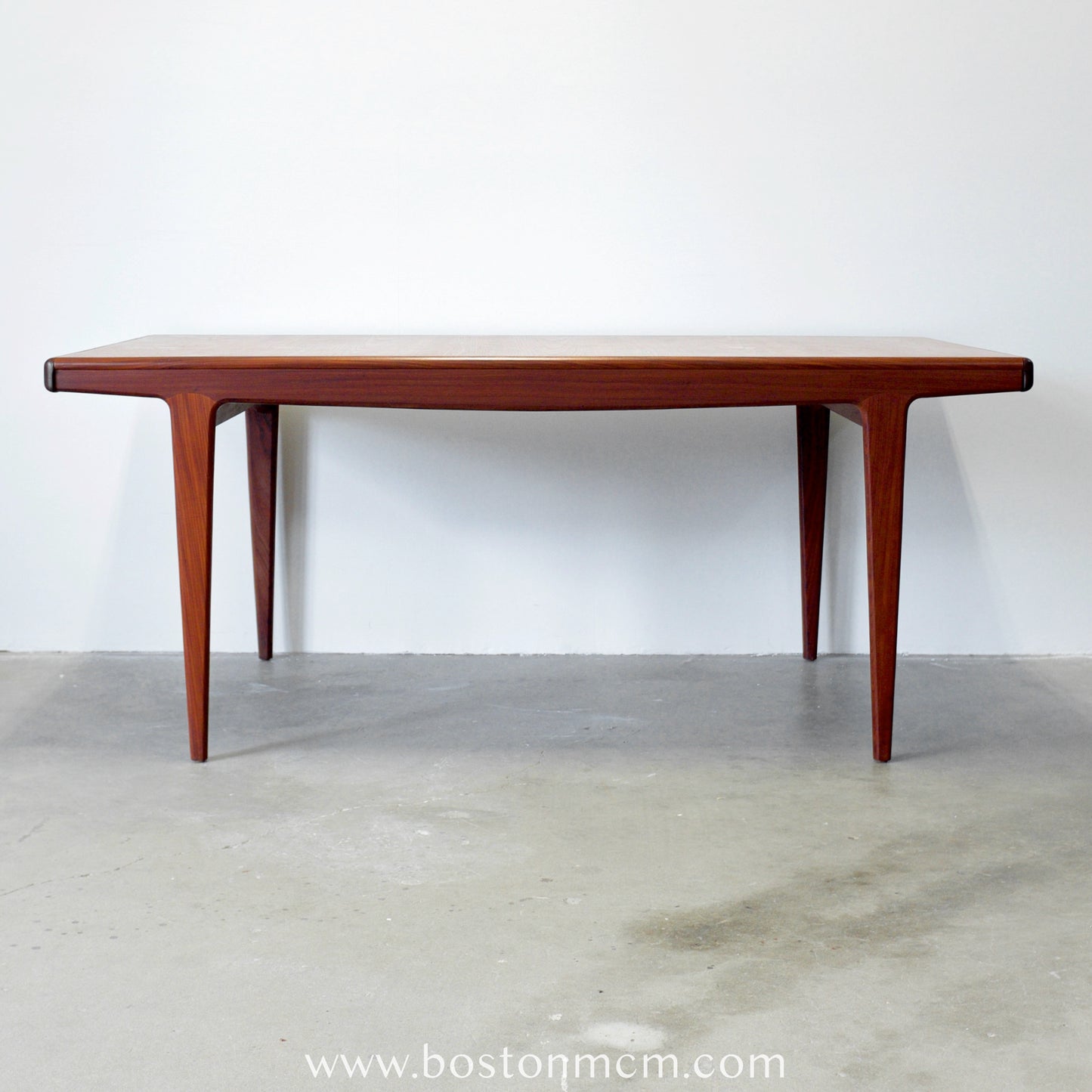 A. Younger Furniture Teak Dining Table with Hidden Leaves