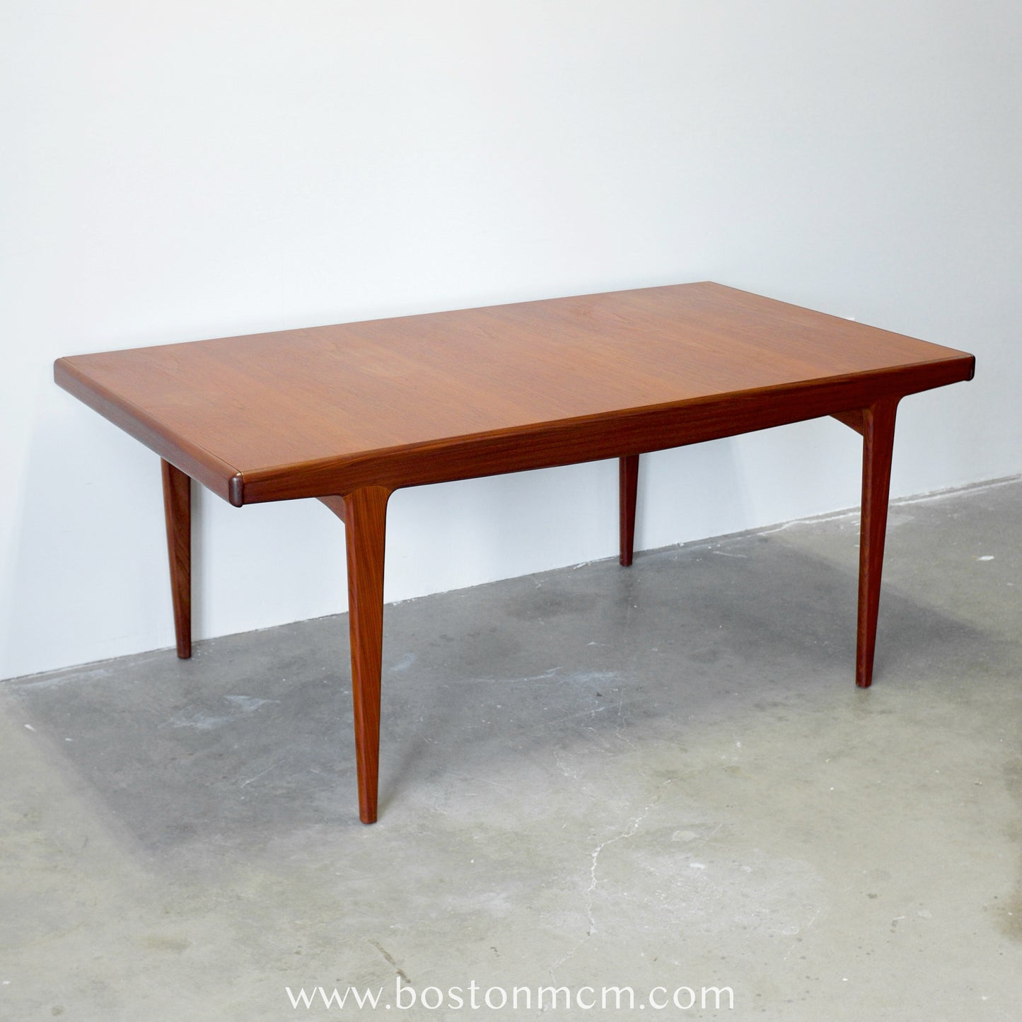 A. Younger Furniture Teak Dining Table with Hidden Leaves