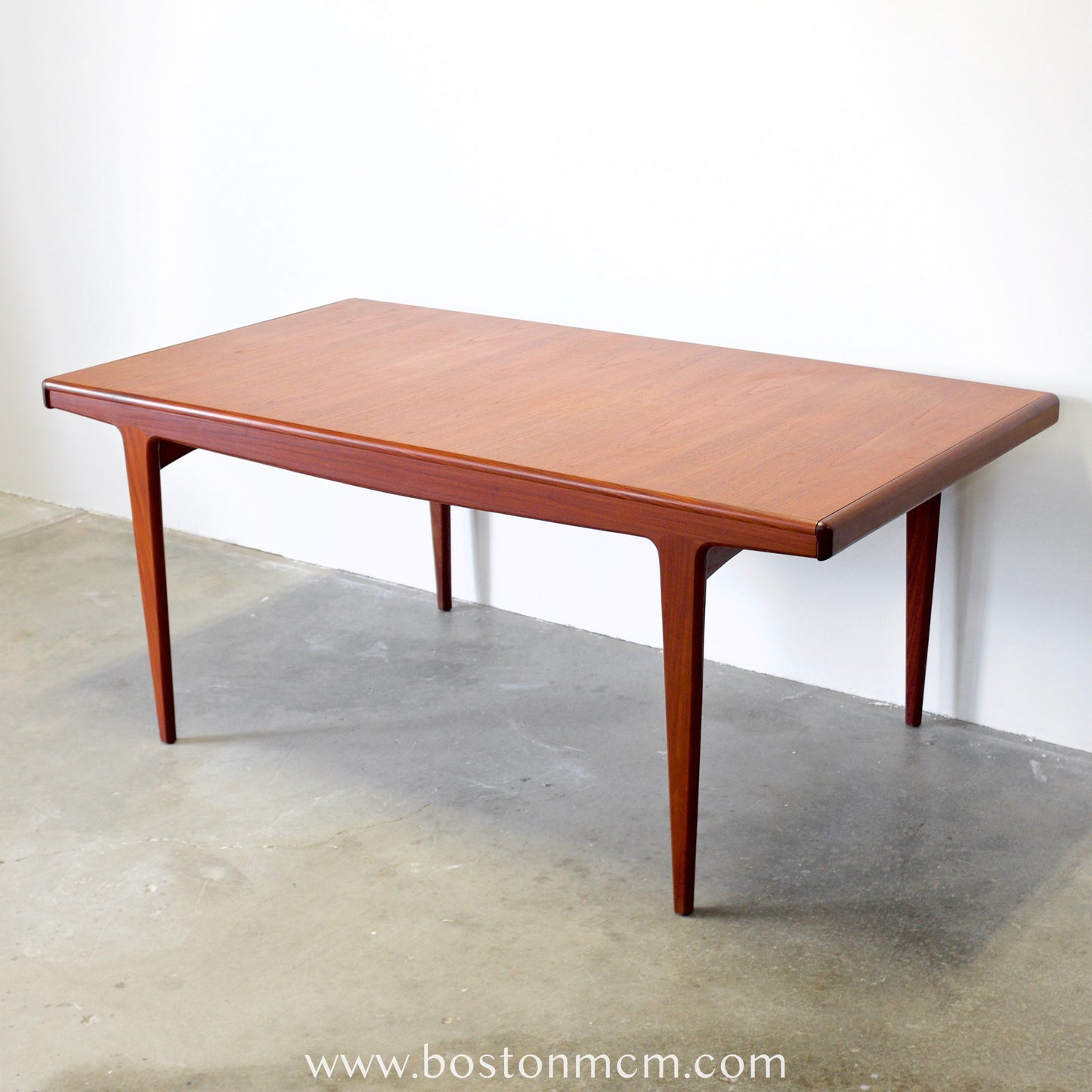 A. Younger Furniture Teak Dining Table with Hidden Leaves