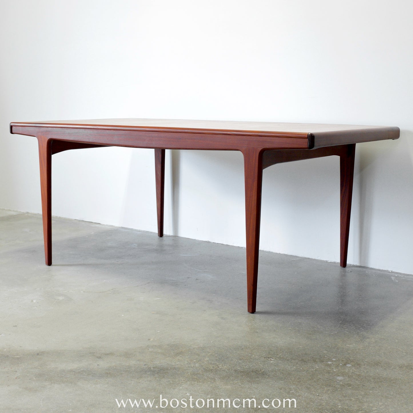 A. Younger Furniture Teak Dining Table with Hidden Leaves