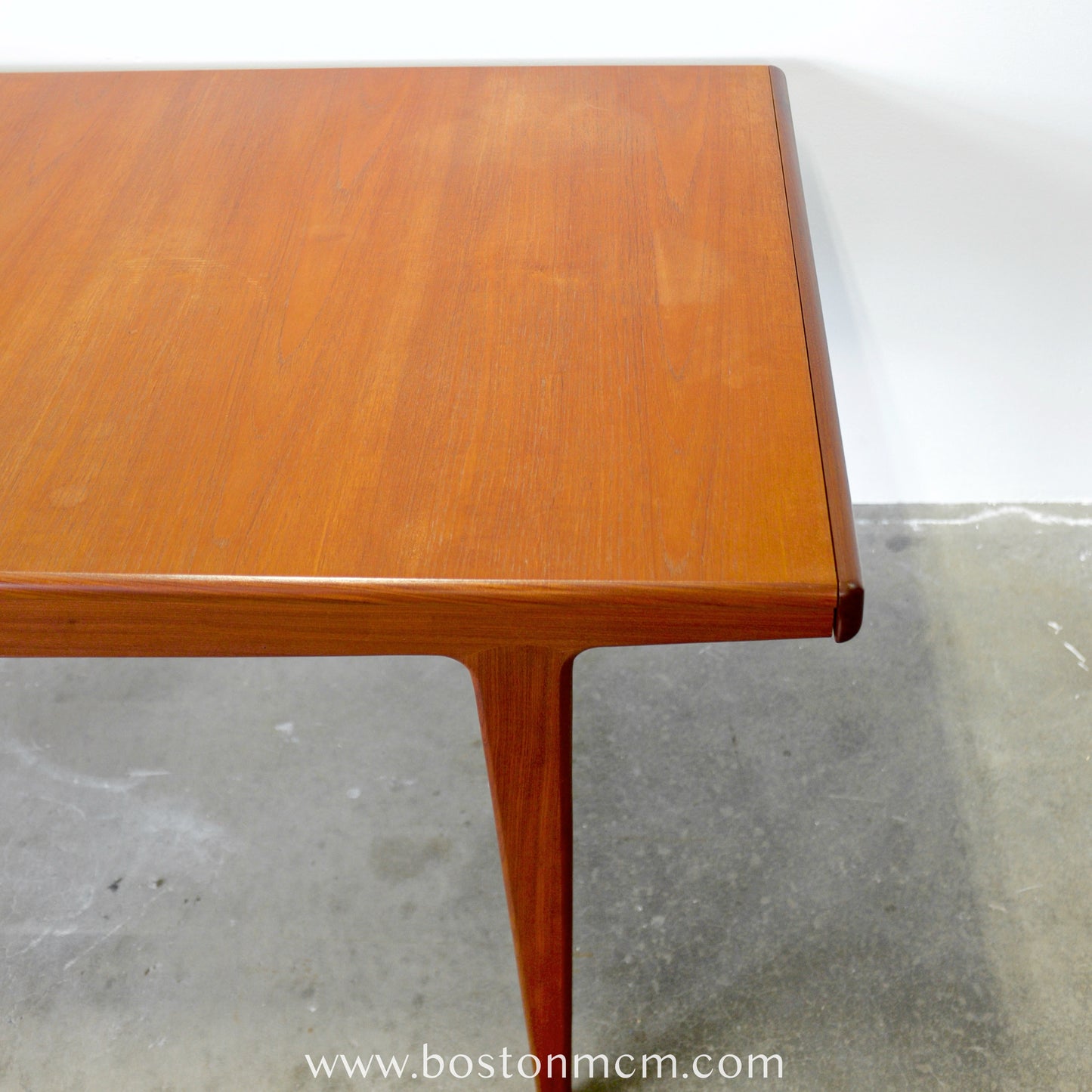 A. Younger Furniture Teak Dining Table with Hidden Leaves