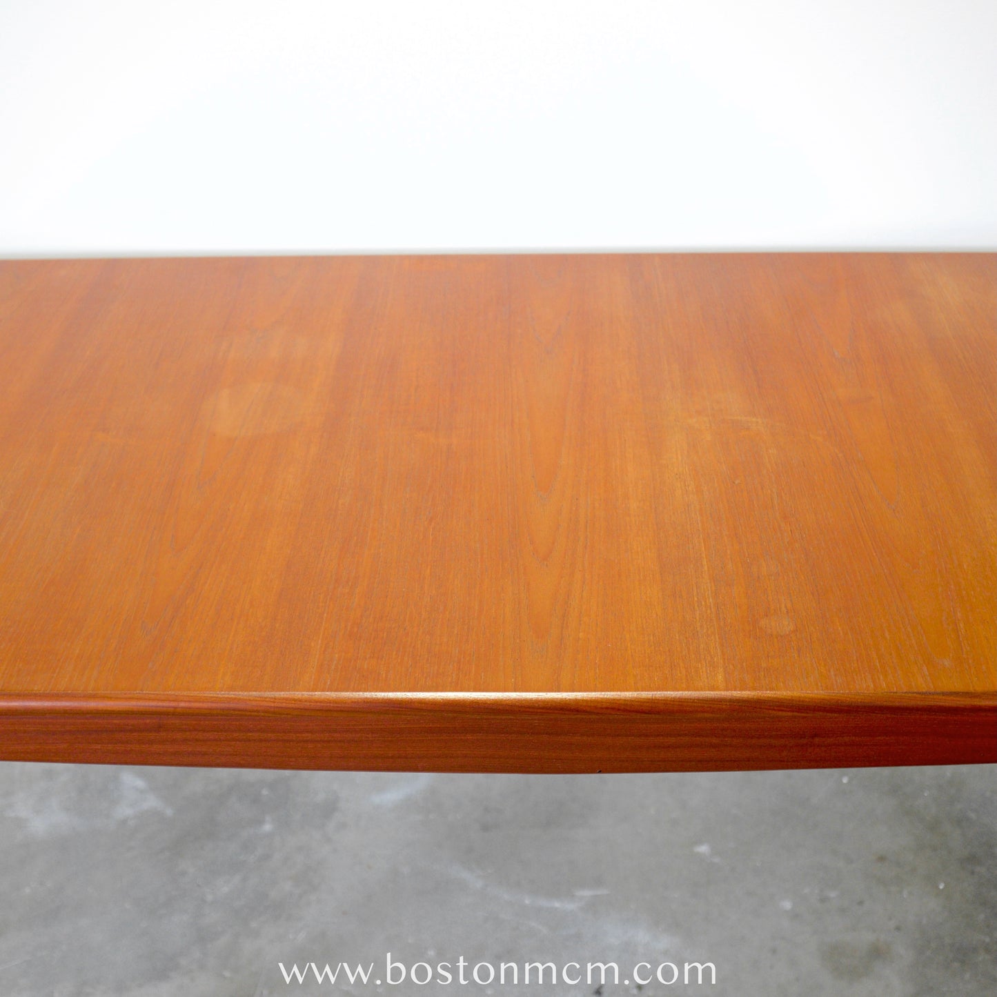 A. Younger Furniture Teak Dining Table with Hidden Leaves