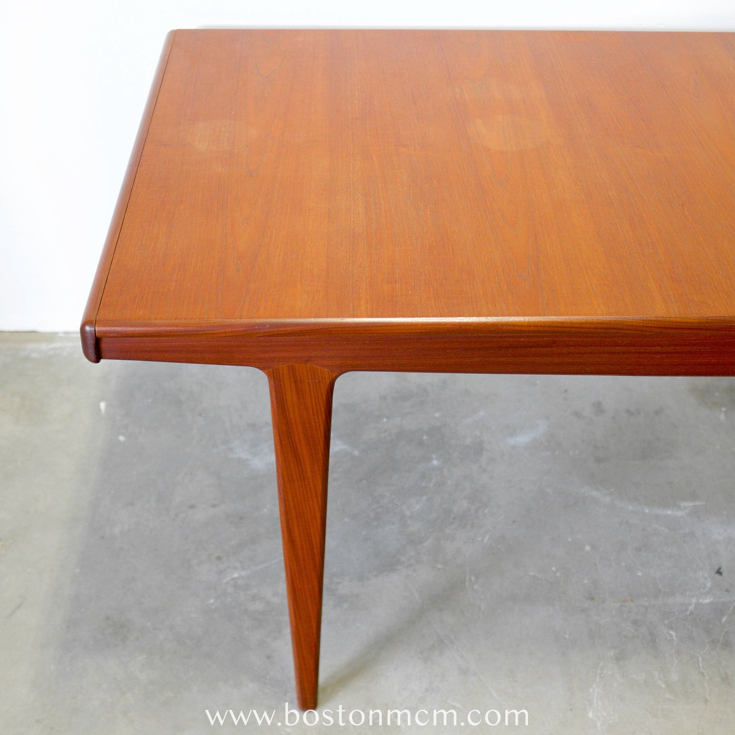 A. Younger Furniture Teak Dining Table with Hidden Leaves