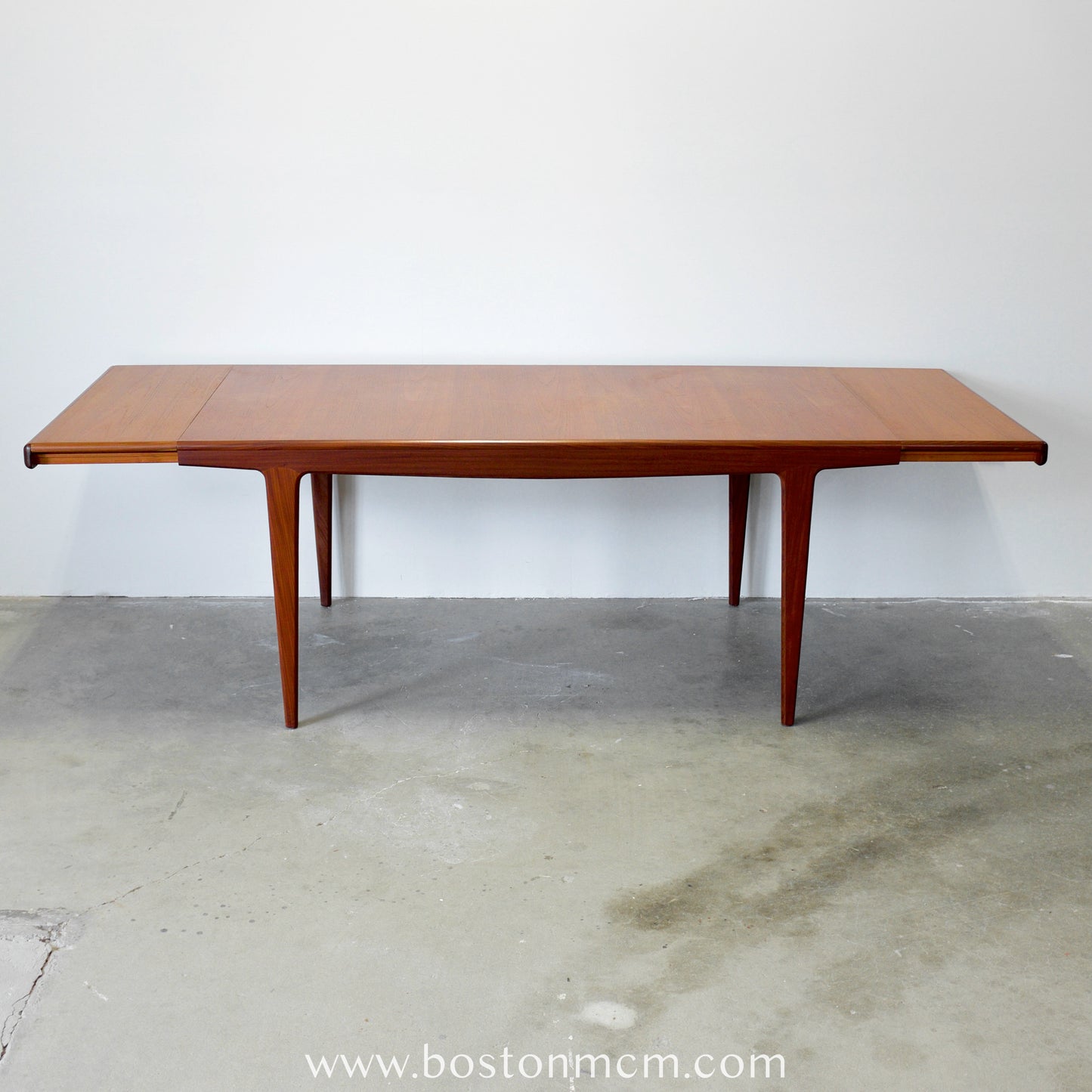 A. Younger Furniture Teak Dining Table with Hidden Leaves