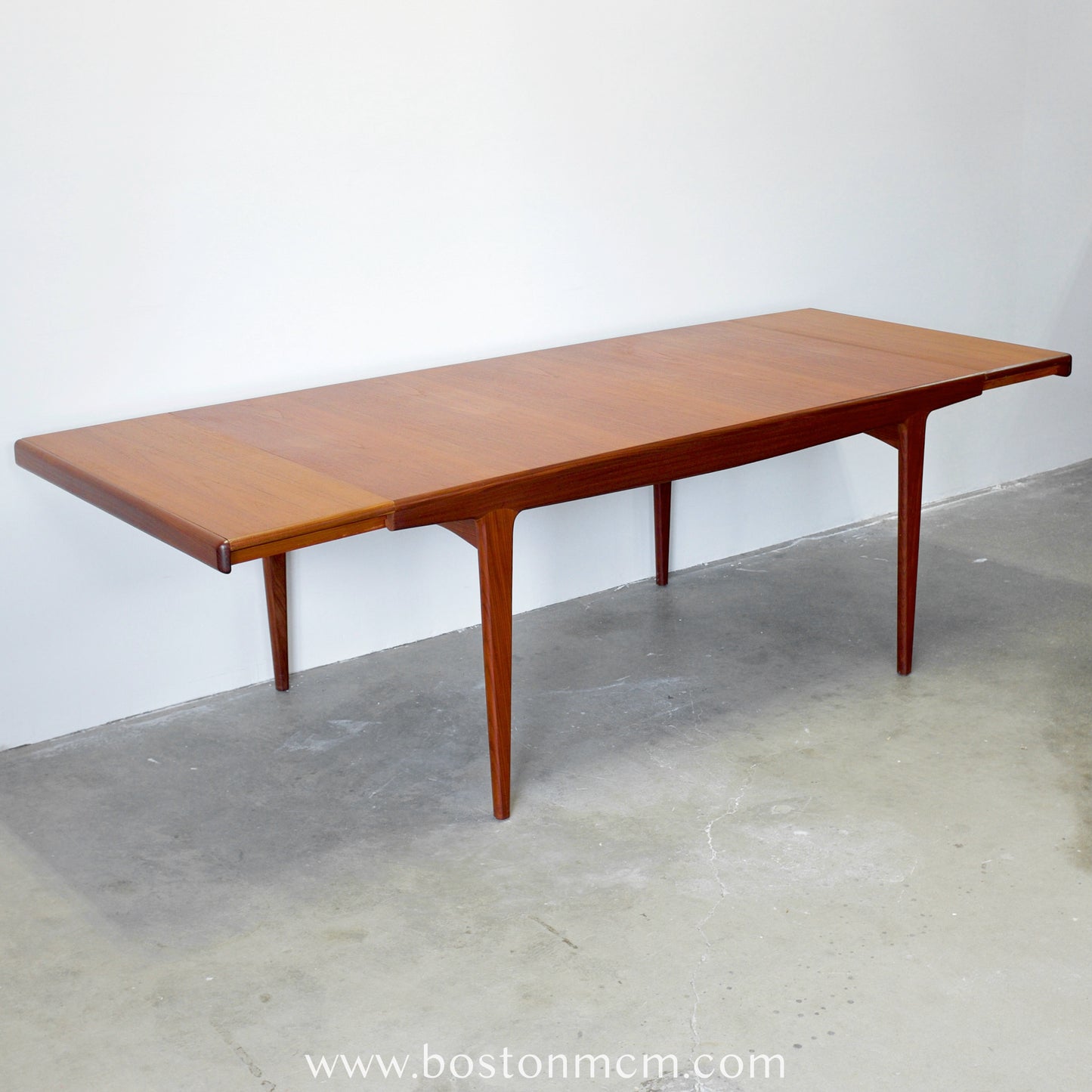 A. Younger Furniture Teak Dining Table with Hidden Leaves