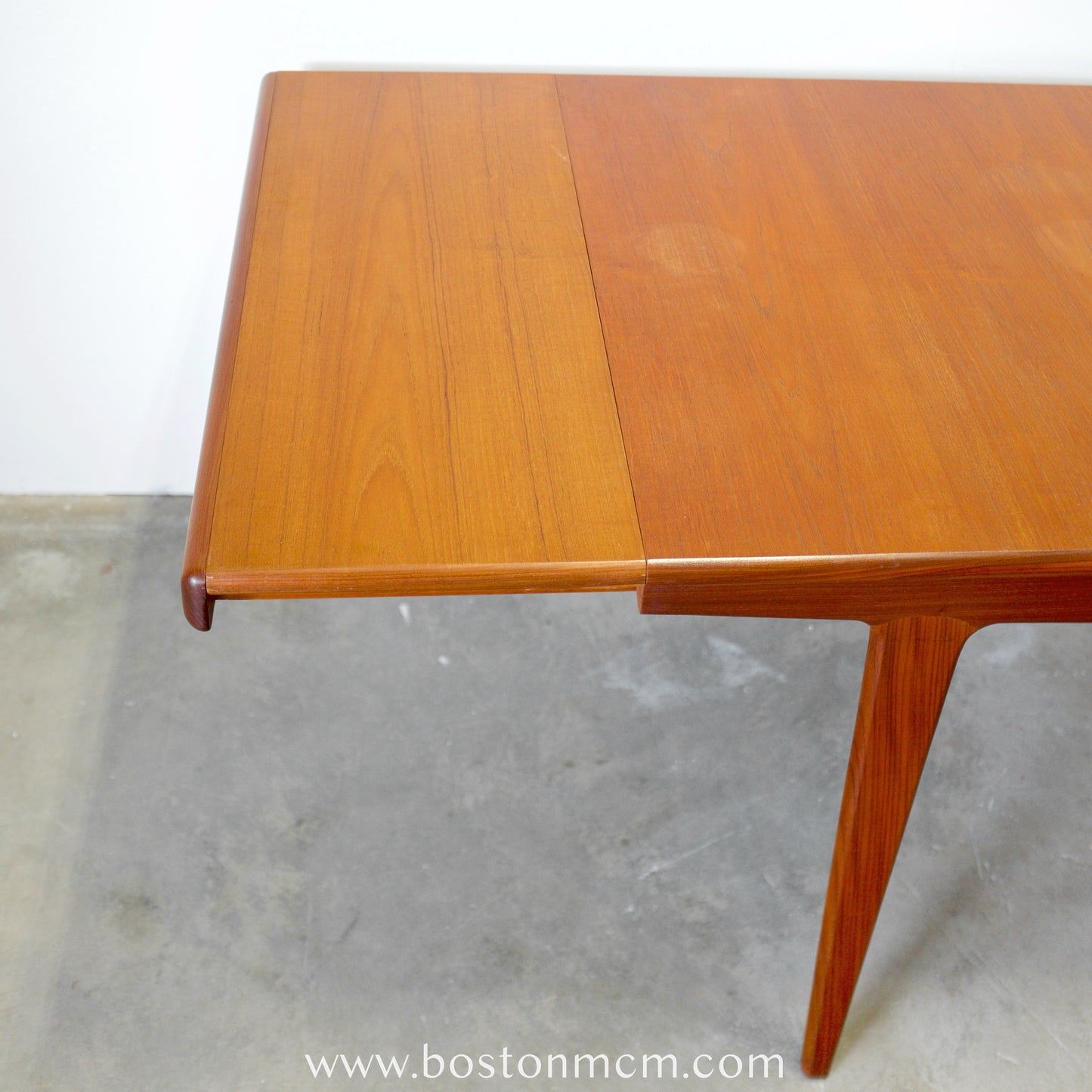 A. Younger Furniture Teak Dining Table with Hidden Leaves