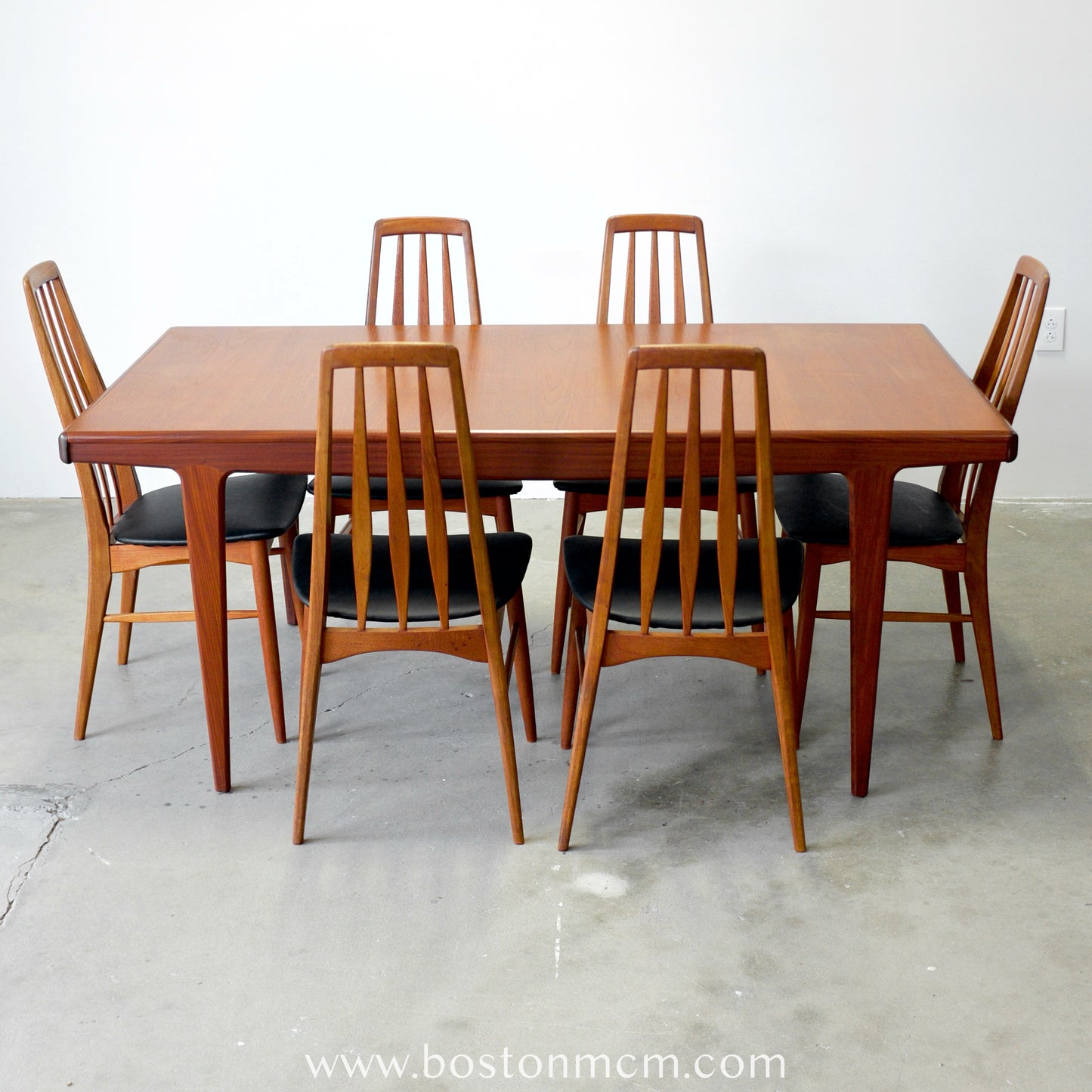 A. Younger Furniture Teak Dining Table with Hidden Leaves