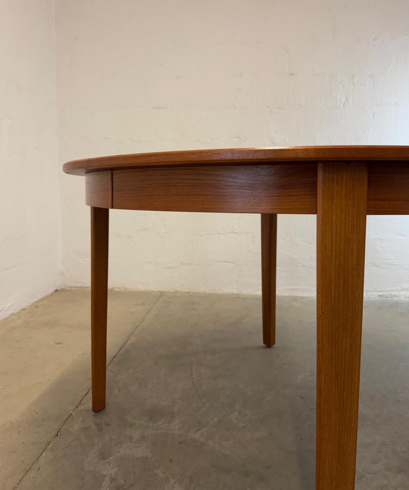 Danish Round Teak Dining Table with 6 Leaves Designed by Henning Kjaernulf - #A2114