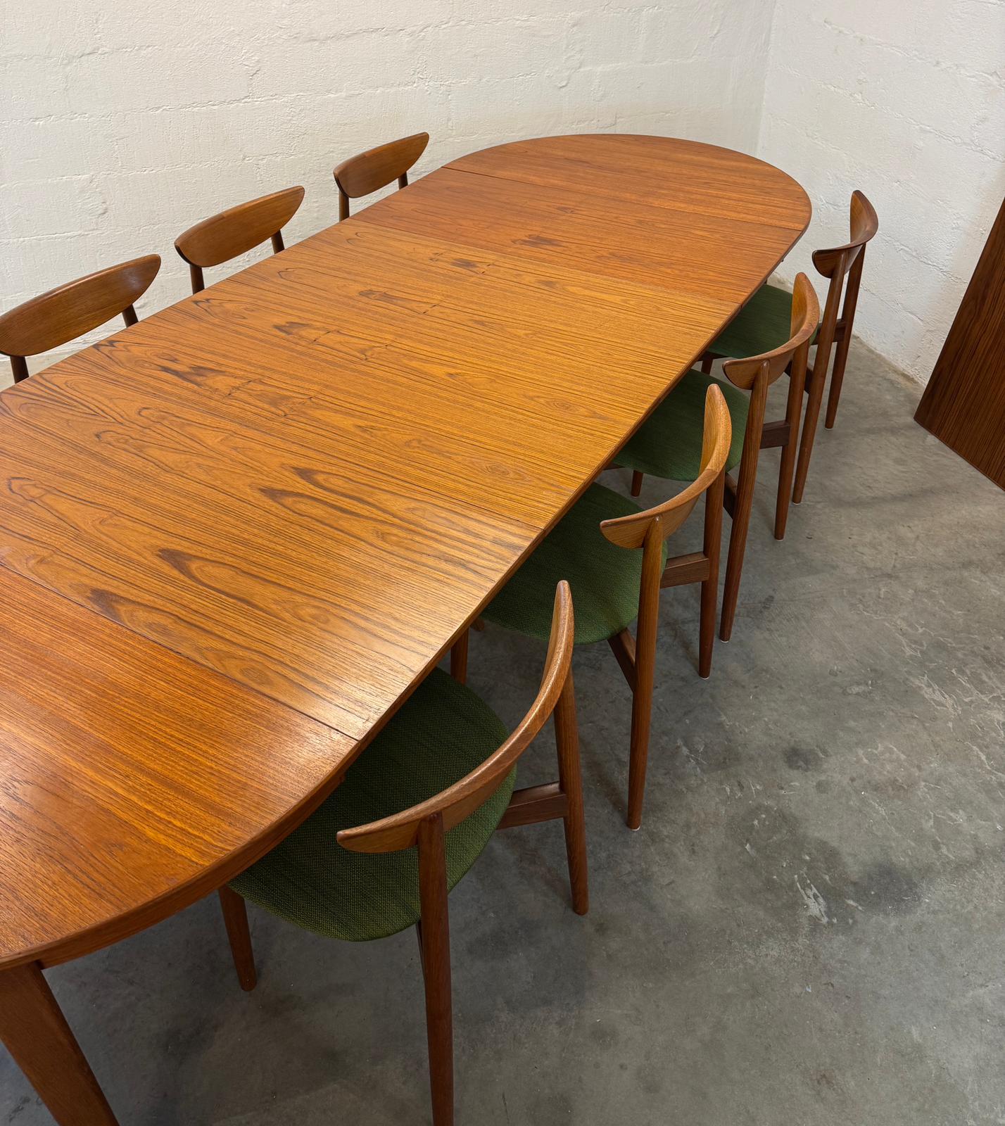 Danish Round Teak Dining Table with 6 Leaves Designed by Henning Kjaernulf - #A2114